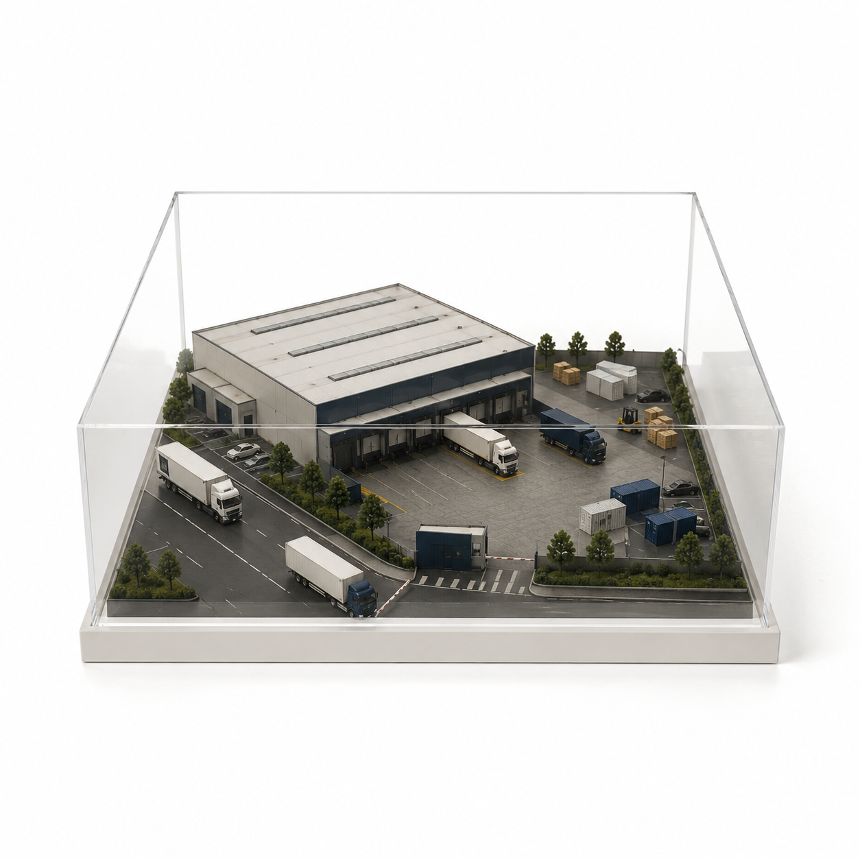 Miniature scale model of a logistics warehouse and truck yard